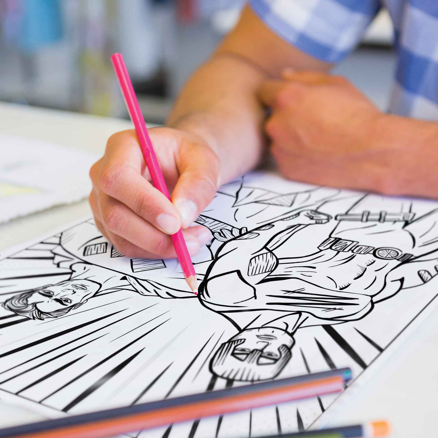 Coloring in a superhero coloring page